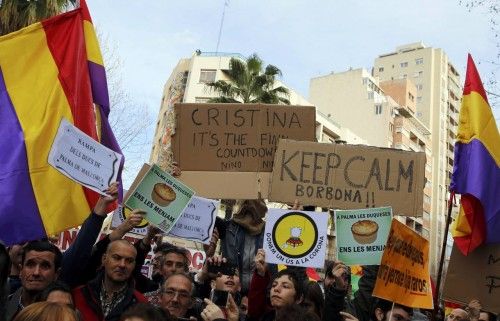 Protestors hold banners and republican flags as they gather near the courthouse where Spain's Princess Cristina, daughter of King Juan Carlos, is testifying before judge Castro over tax fraud and money-laundering charges in Palma de Mallorca