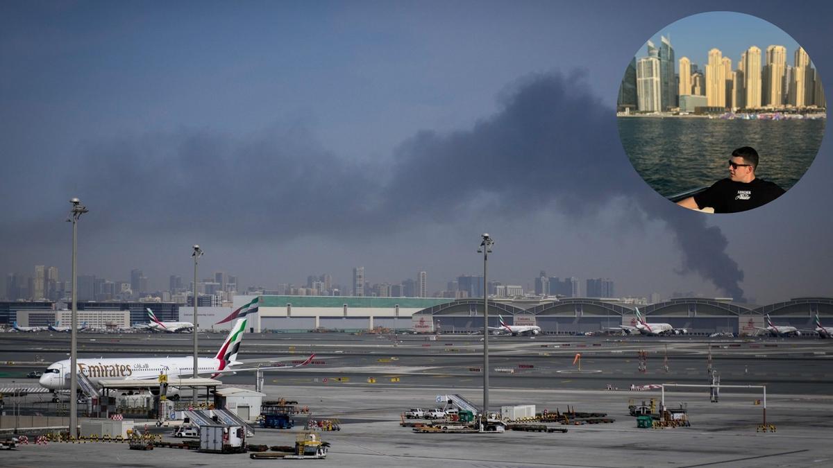 Imagen del Aeropuerto Internacional de Dubai, al fondo una columna de humo fruto de un ataque aéreo