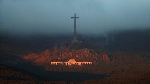 The Valle de los Caidos (The Valley of the Fallen), the state mausoleum where late Spanish dictator Francisco Franco is buried, is seen at dusk in San Lorenzo de El Escorial in this picture taken from Guadarrama, near Madrid, Spain, October 24, 2019. REUTERS/Sergio Perez