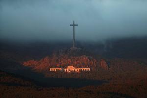 The Valle de los Caidos (The Valley of the Fallen), the state mausoleum where late Spanish dictator Francisco Franco is buried, is seen at dusk in San Lorenzo de El Escorial in this picture taken from Guadarrama, near Madrid, Spain, October 24, 2019. REUTERS/Sergio Perez