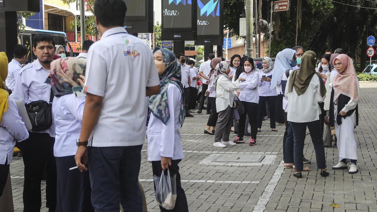 People stay outside after a 5.6 magnitude earthquake shakes West Java