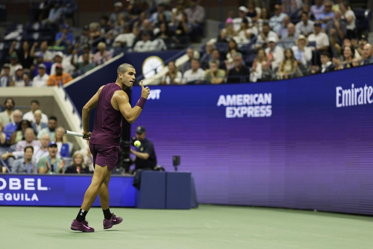 Carlos Alcaraz, of Spain, reacts against Reilly Opelka, of the United States, during the first round of the U.S. Open tennis championships, Monday, Aug. 25, 2025, in New York. (AP Photo/Adam Hunger)