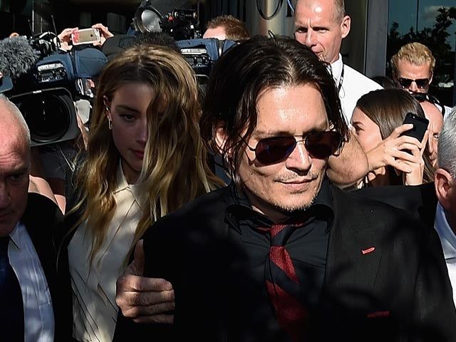 Amber Heard irá a julgamento por levar cachorros de Johnny Depp à Austrália