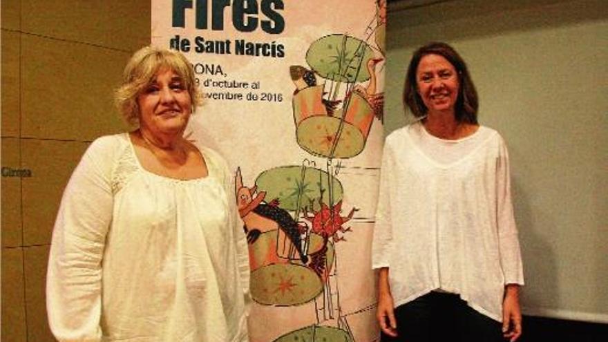 Eva Palau i Marta Madrenas amb el cartell de les Fires.