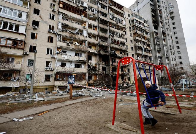 A residential building is damaged, after Russia launched a massive military operation against Ukraine, in Kyiv