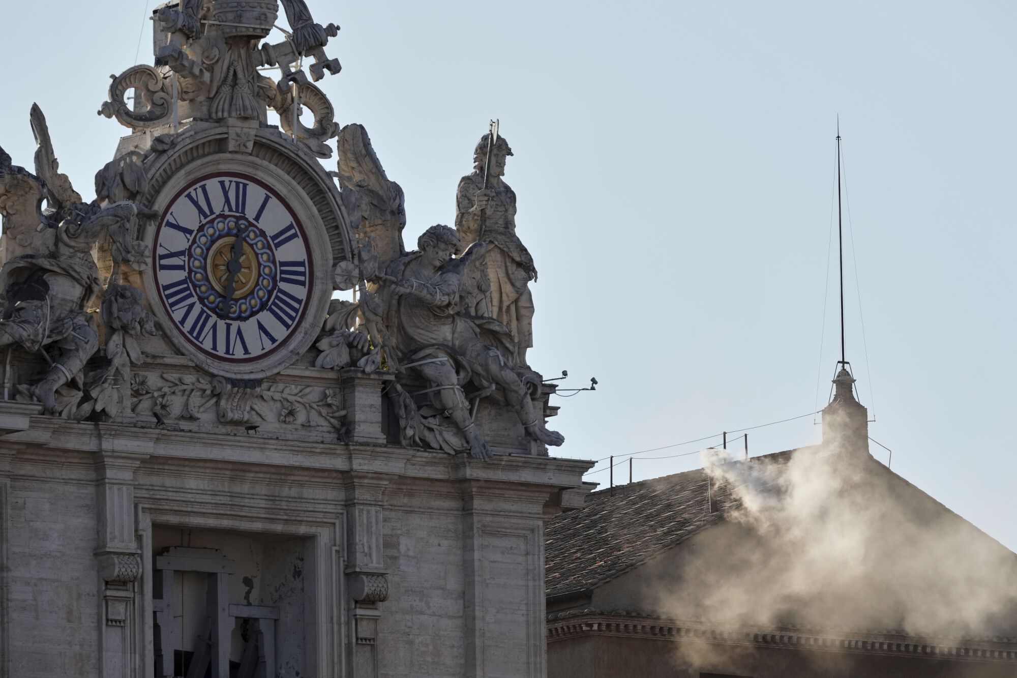 White smoke billows from the chimney of the Sistine Chapel during the conclave to elect a successor of late Pope Francis, at the Vatican, Thursday, May 8, 2025. (AP Photo/Antonio Calanni)