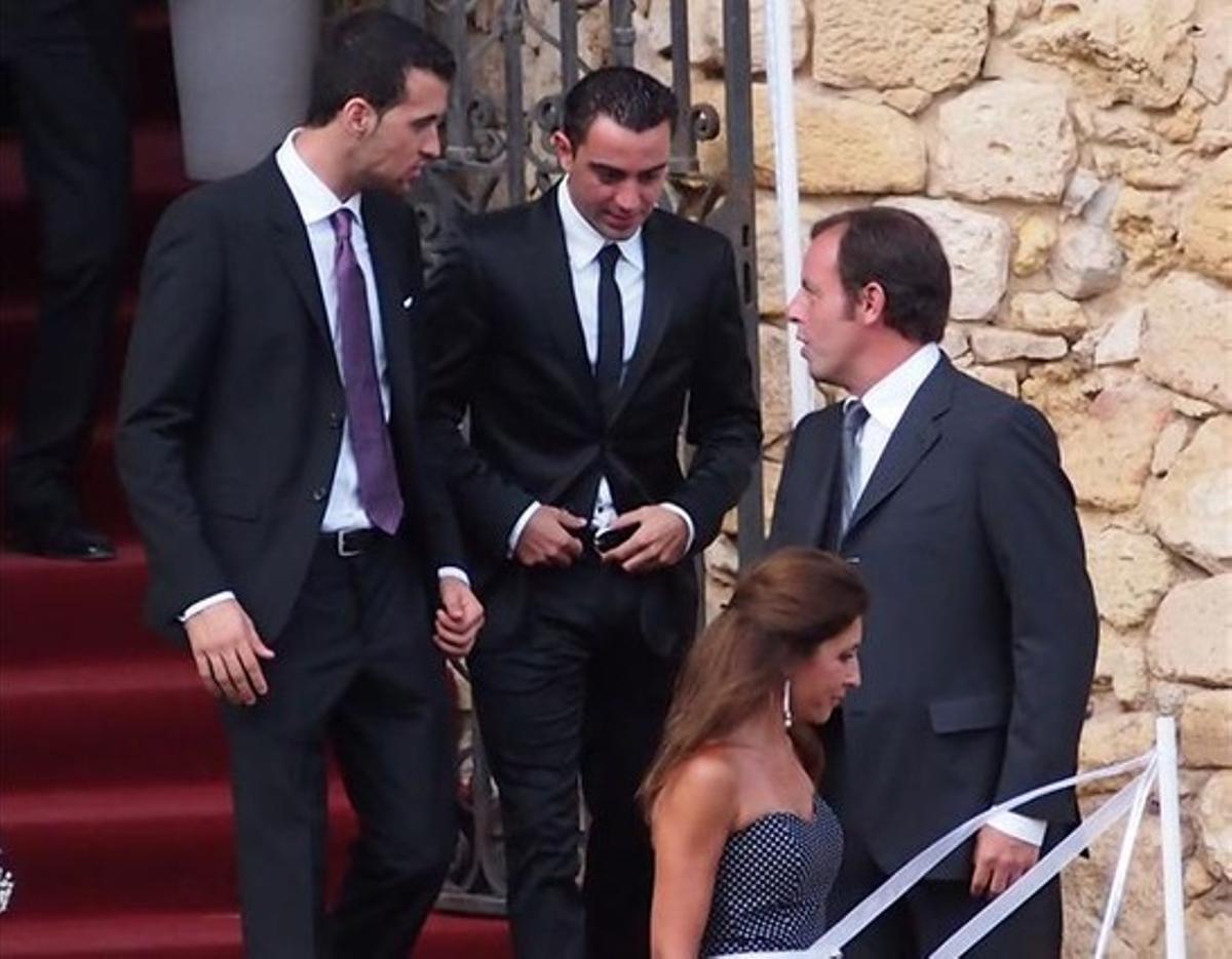 El president del Barça, Sandro Rosell, amb Xavi i Busquets.