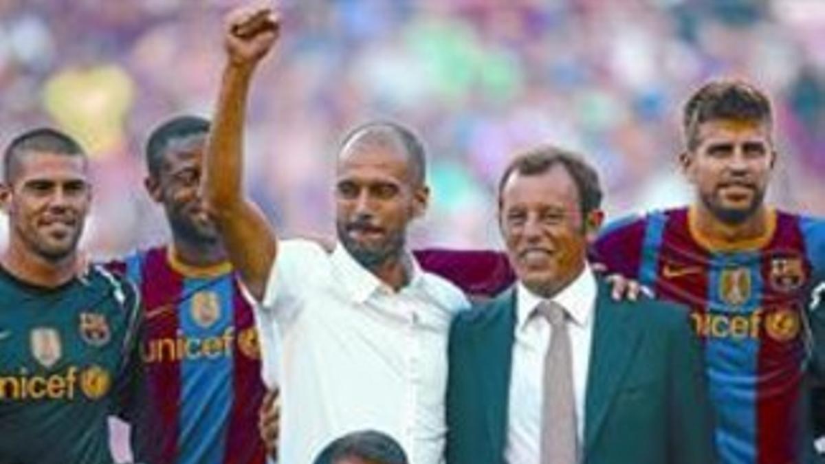 Guardiola, junto a Rosell y Laporta, en la celebración de la Liga el año pasado.