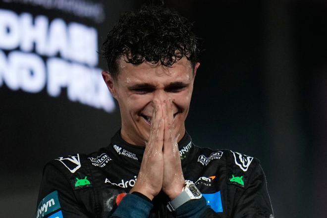 McLaren driver Lando Norris of Britain reacts after becoming a world champion after the Abu Dhabi Formula One Grand Prix in Abu Dhabi, United Arab Emirates, Sunday, Dec. 7, 2025. (AP Photo/Darko Bandic). EDITORIAL USE ONLY / ONLY ITALY AND SPAIN