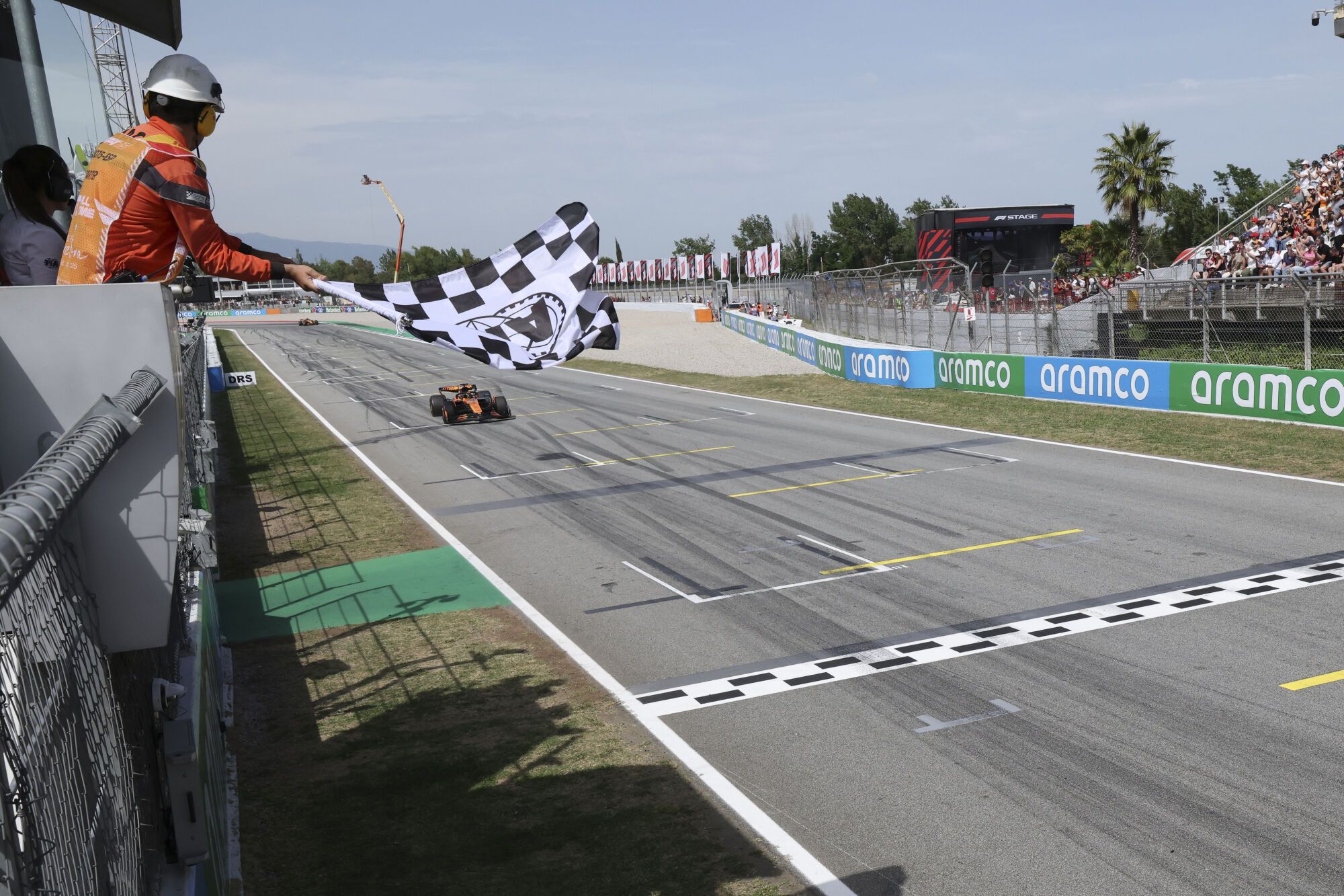 McLaren driver Oscar Piastri of Australia approaches the finish line to win the Spanish Grand Prix Formula One race at the Barcelona Catalunya racetrack in Montmelo, near Barcelona, Spain, Sunday, June 1, 2025. (Albert Gea/Pool Photo via AP). POOL PHOTO