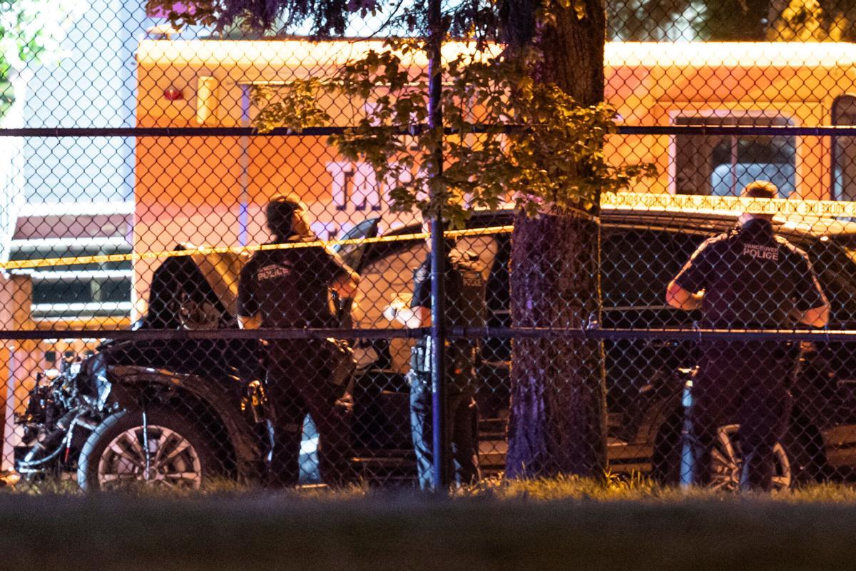 Vancouver police examine a black car suspected to be involved at a scene after a vehicle drove into a crowd at the Lapu Lapu Festival in Vancouver, British Columbia, Saturday April 26, 2025. (Rich Lam/The Canadian Press via AP). MANDATORY CREDIT Vancouver police examine a black car suspected to be involved at a scene after a vehicle drove into a crowd at the Lapu Lapu Festival in Vancouver, British Columbia, Saturday April 26, 2025. (Rich Lam/The Canadian Press via AP). MANDATORY CREDIT