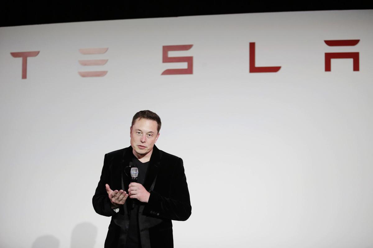 FILE - In a Sept. 29, 2015, file photo, Elon Musk, CEO of Tesla Motors Inc., talks about the Model X car at the company’s headquarters, in Fremont, Calif.  Unable to string together profitable quarters, electric car and solar cell maker Tesla Inc. reported a loss for the last three months of 2016. (AP Photo/Marcio Jose Sanchez, File)