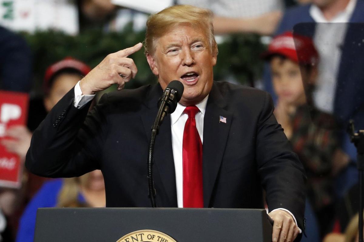 President Donald Trump talks about the fake snow that fell on his hair during a rally in the Mississippi Coast Coliseum  Monday  Nov  26  2018  in Biloxi  Miss   AP Photo Rogelio V  Solis