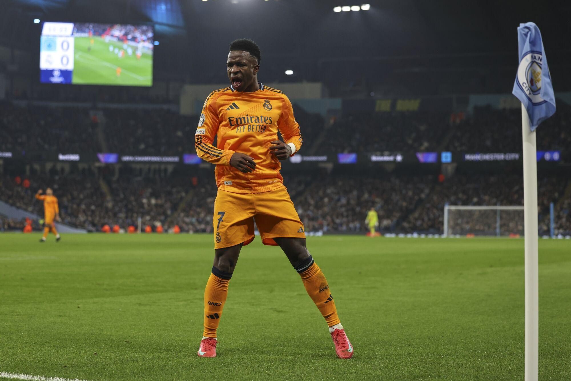 Real Madrid's Vinicius Junior reacts during the Champions League playoff first leg soccer match between Manchester City and Real Madrid at the Etihad Stadium in Manchester, England, Tuesday, Feb. 11, 2025. (AP Photo/Darren Staples)