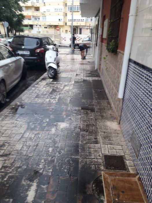 Los efectos de las fuertes lluvias en el barrio de Huelin