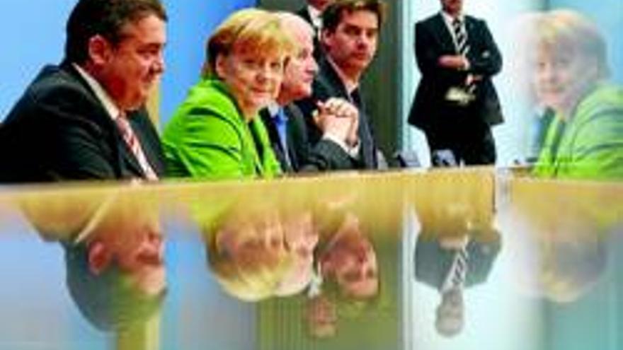 Merkel y los socialdemócratas sellan al fin un pacto de coalición