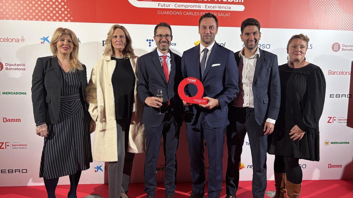 Els representants de Paulig, amb el reconeixement