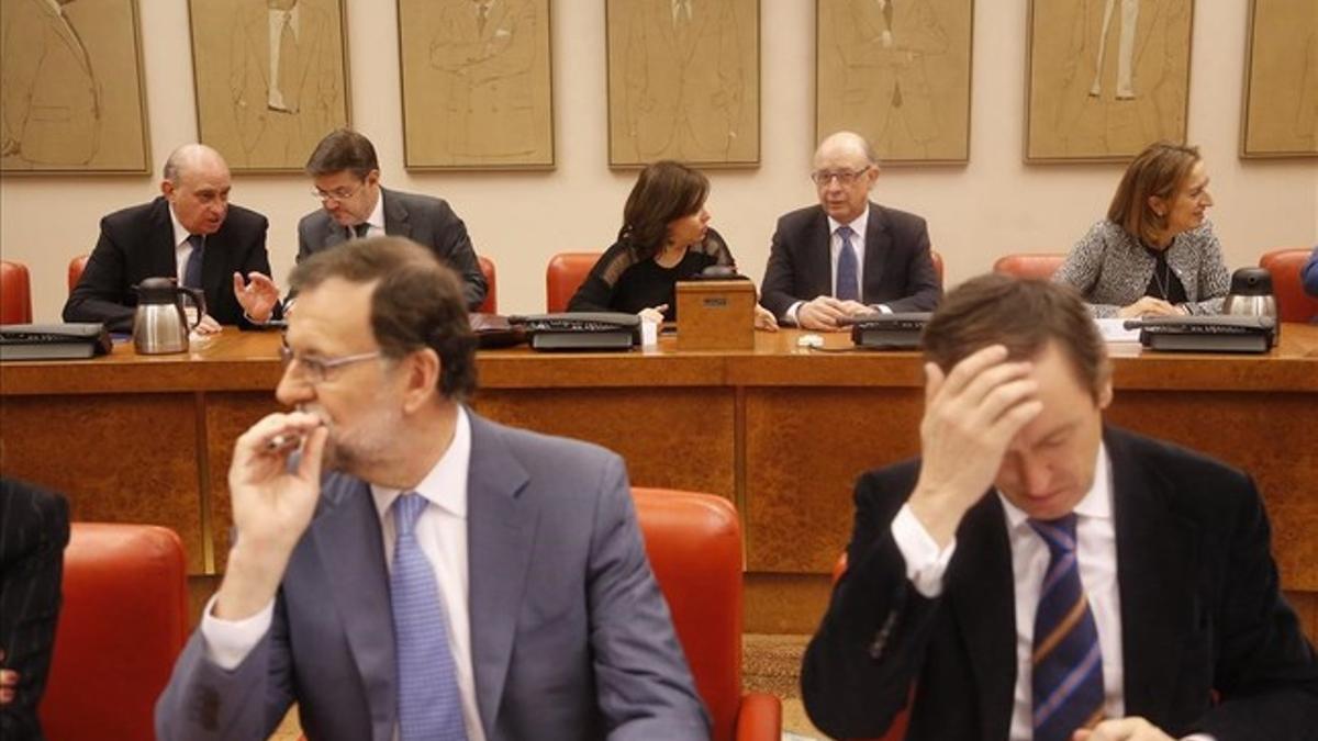 El presidente del PP, Mariano Rajoy, este jueves en la reunión del grupo parlamentario popular en el Congreso.