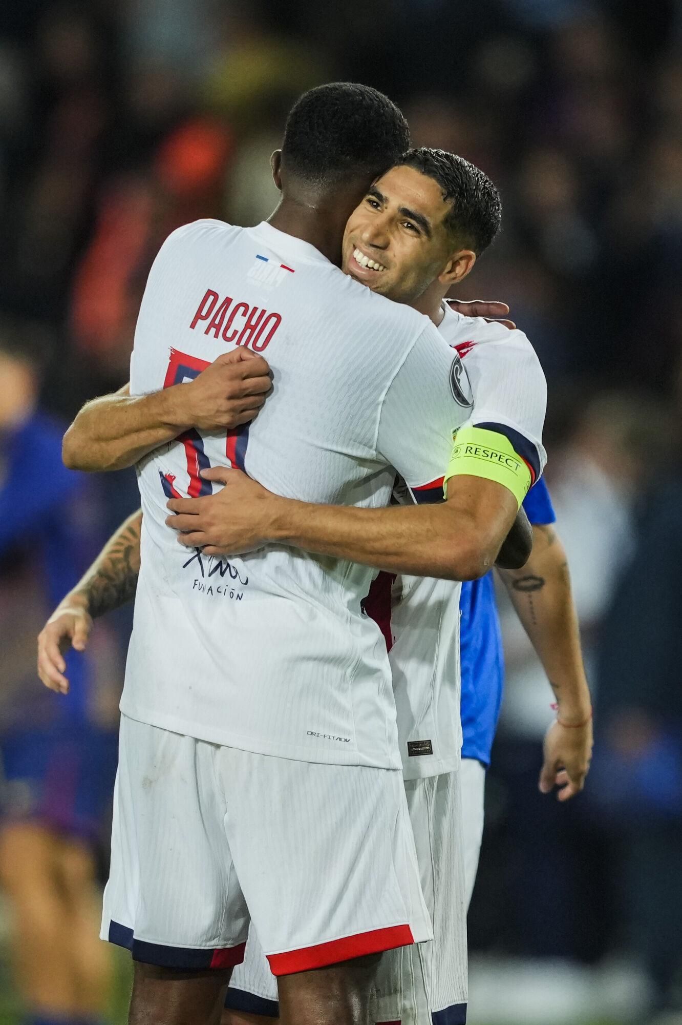 Paris Saint Germain's Willian Pacho (L) and Achraf Hakimi (R) celebrate the victory at the end of the UEFA Champions League phase soccer match between FC Barcelona and PSG in Barcelona, Spain, 01 October 2025. EFE/Alejandro Garcia