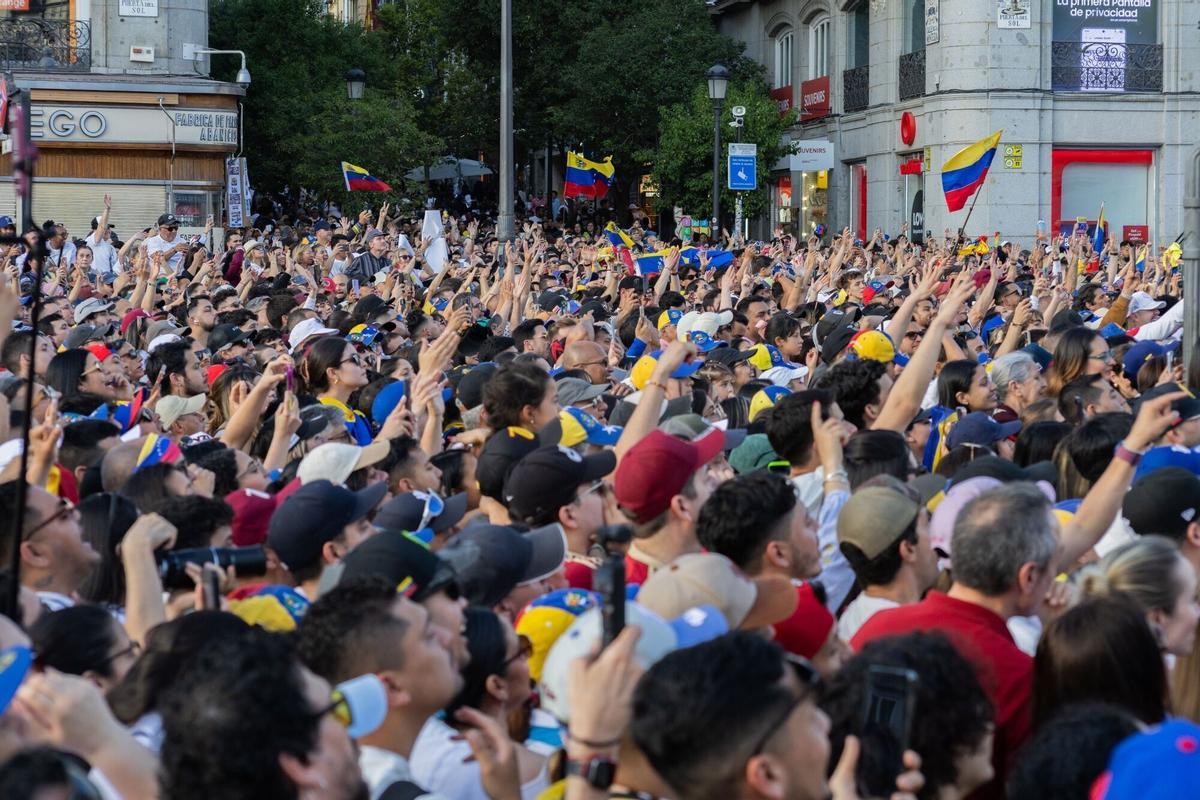 Supporters of Maria Corina Machado, Venezuela's opposition leader, not pictured, cheer during an event in Madrid, Spain, on Saturday, April 18, 2026. Machado said she's "coordinating" her return to the country with the US, without giving a date. Photographer: Claudia Paparelli/Bloomberg