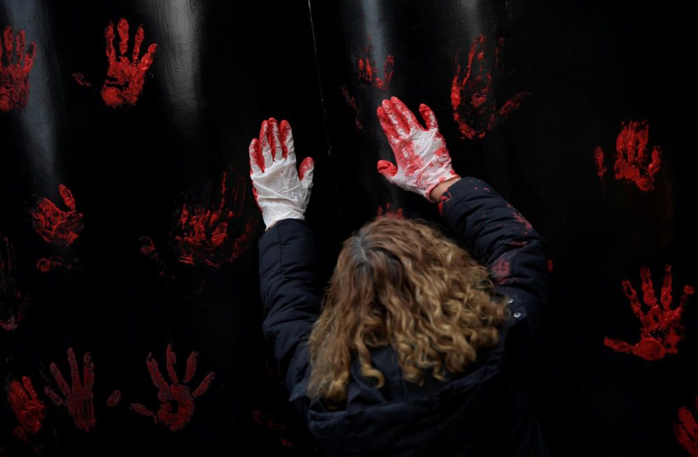 People take part in a protest after a Spanish ...