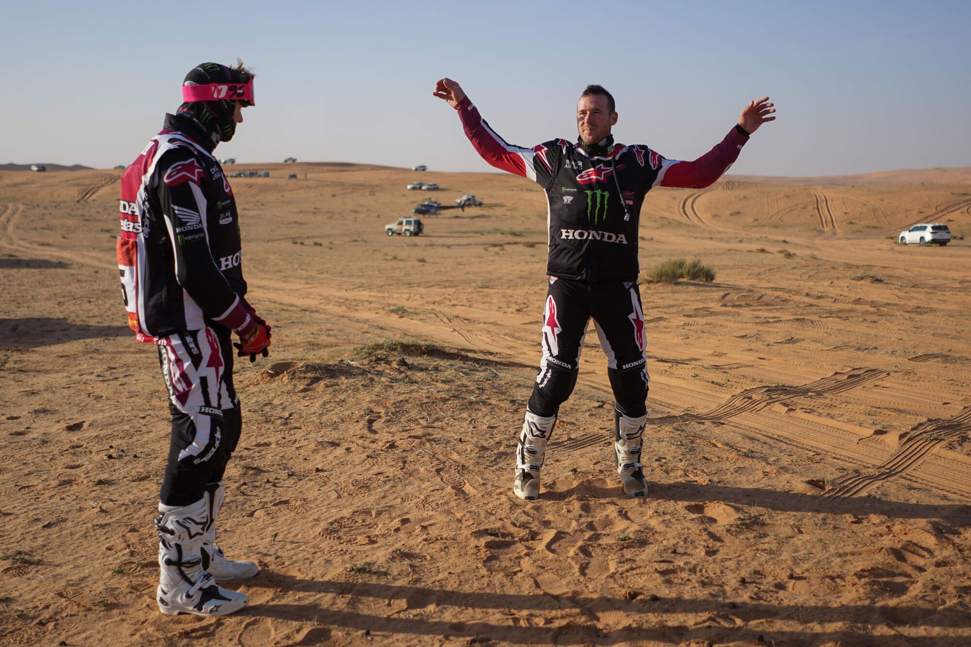 Rider Ricky Brabec, right, warms up prior to the start of the sixth stage of the Dakar Rally between Hail and Riyadh, Saudi Arabia, Friday, Jan. 9, 2026. (AP Photo/Thibault Camus). EDITORIAL USE ONLY/ONLY ITALY AND SPAIN