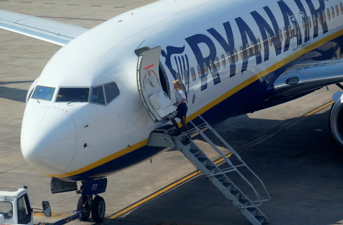 A cabin crew staff member enters a Ryanair plane at the airport, during a protest on the second and last day of a cabin crew strike held in several European countries, in Valencia, Spain July 26, 2018 REUTERS/Heino Kalis