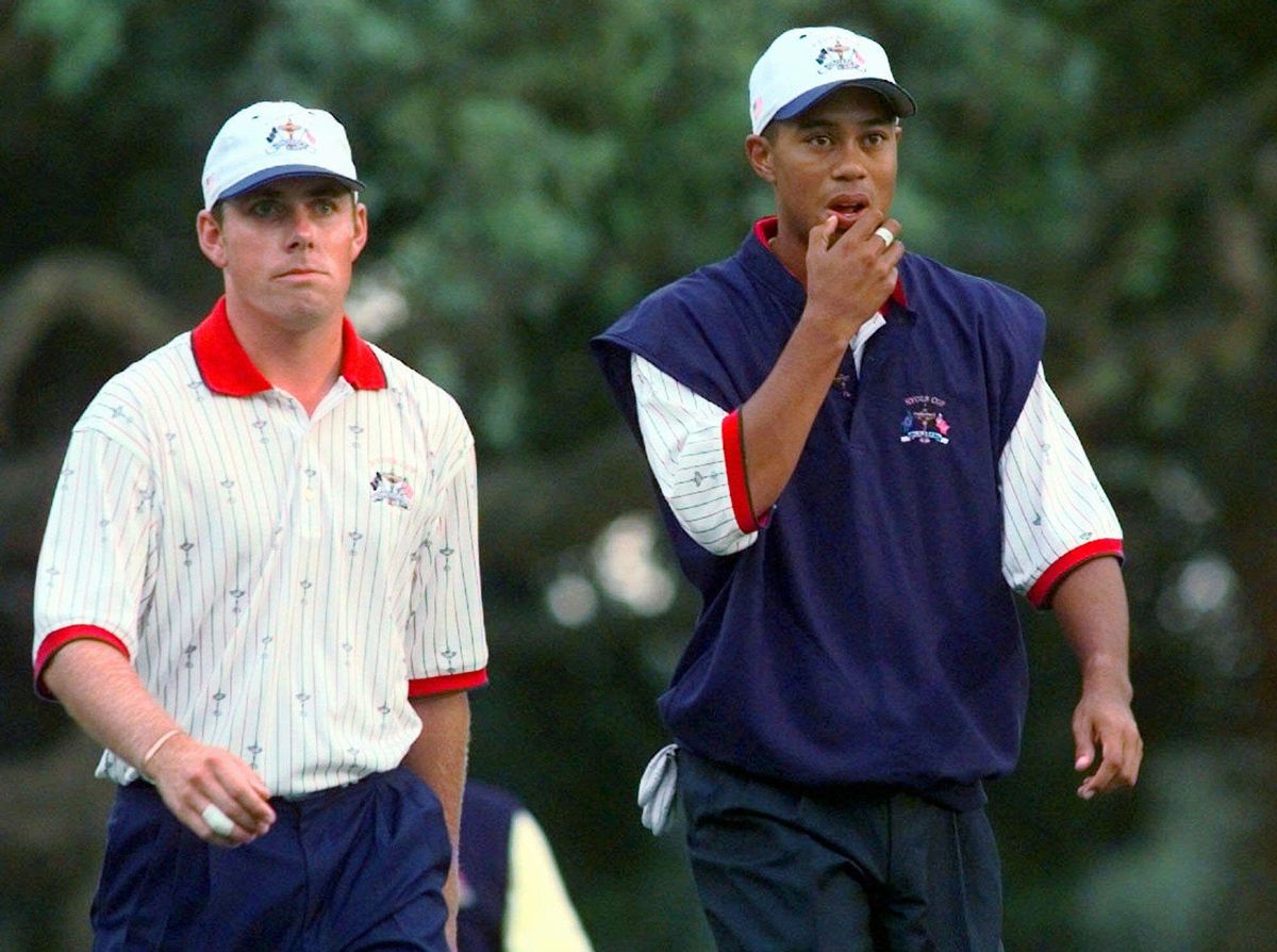 United States Ryder Cup players Tiger Woods and Justin Leonard, left, walk down the first fairway during their foursome match on day two of the Ryder Cup at Valderrama golf course Saturday Sept. 27, 1997. (AP Photo/Lynne Sladky)