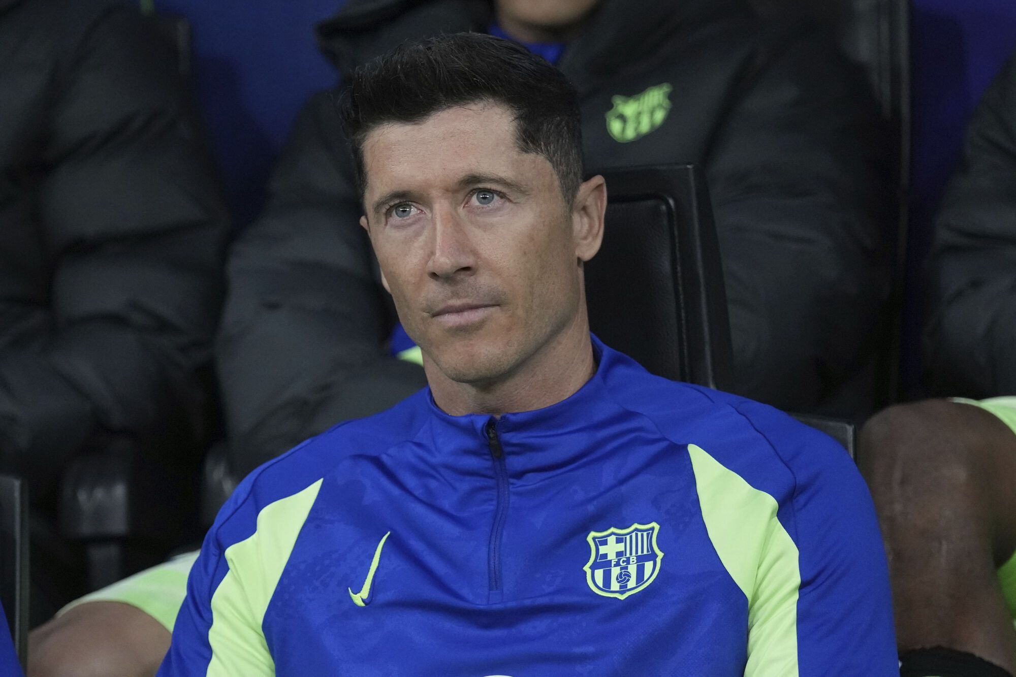 Barcelona's Robert Lewandowski sits on the bench during the Champions League semifinal second leg soccer match between Inter Milan and Barcelona at San Siro stadium in Milan , Italy, Tuesday, May 6, 2025. (AP Photo/Antonio Calanni). EDITORIAL USE ONLY / ONLY ITALY AND SPAIN