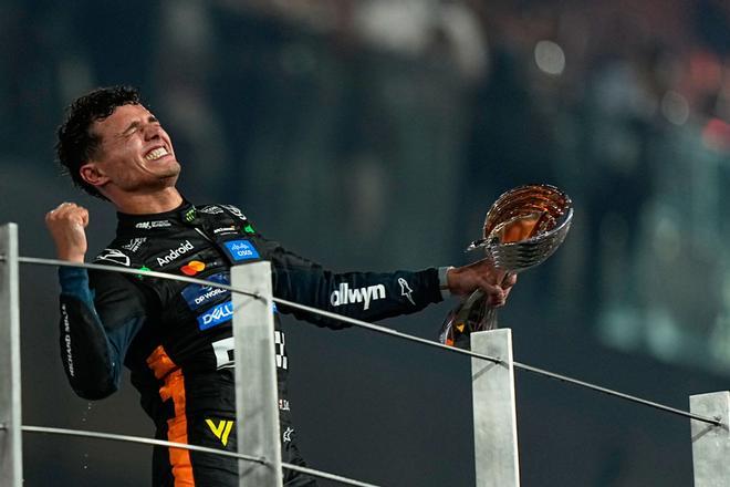 McLaren driver Lando Norris of Britain celebrates after becoming a world champion after the Formula One Abu Dhabi Grand Prix at the Yas Marina Circuit in Abu Dhabi, UAE, Sunday, Dec. 7, 2025. (AP Photo/Fatima Shbair). EDITORIAL USE ONLY / ONLY ITALY AND SPAIN