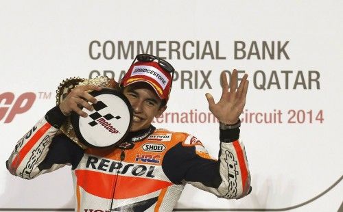 Honda MotoGP rider Marc Marquez of Spain celebrates on the podium after winning the Qatar MotoGP Grand Prix at the Losail International circuit in Doha