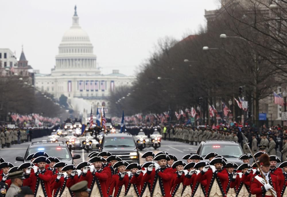 A band marches ahead of U.S. President  Donald ...