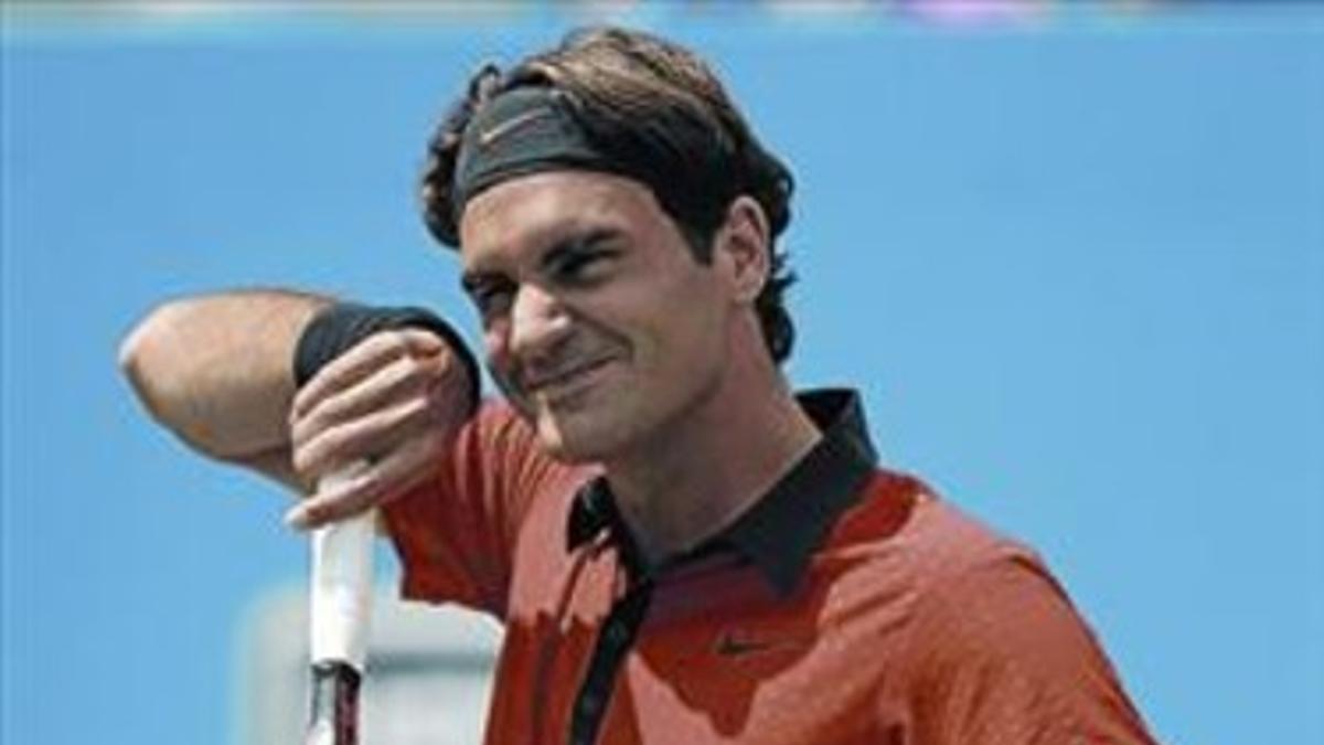 Federer sonríe en un momento de su estreno, ayer en Nueva York.