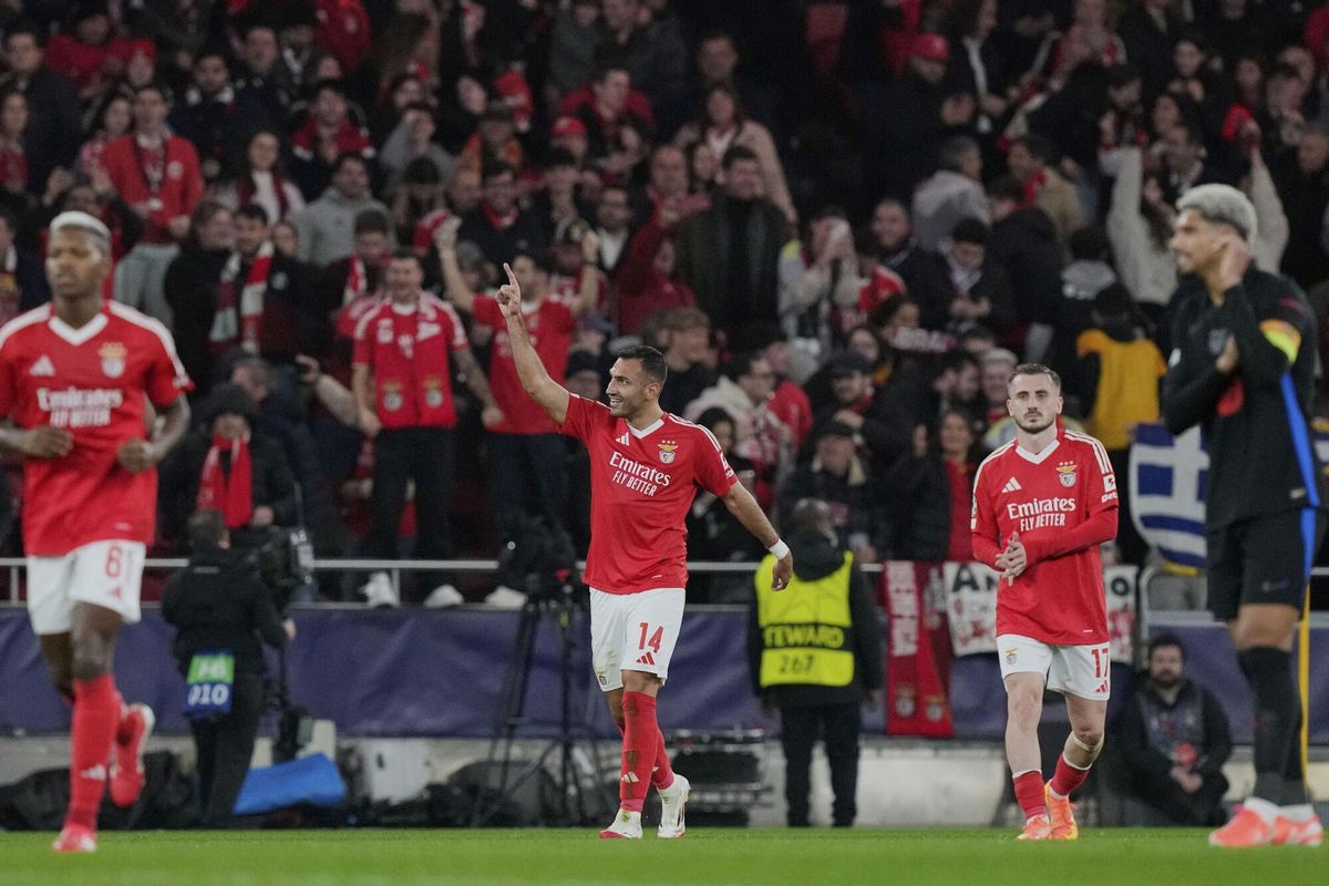 Benficas Vangelis Pavlidis celebrates his sides third goal during a Champions League opening phase soccer match between SL Benfica and FC Barcelona at the Luz stadium in Lisbon, Tuesday, Jan. 21, 2025. (AP Photo/Armando Franca)