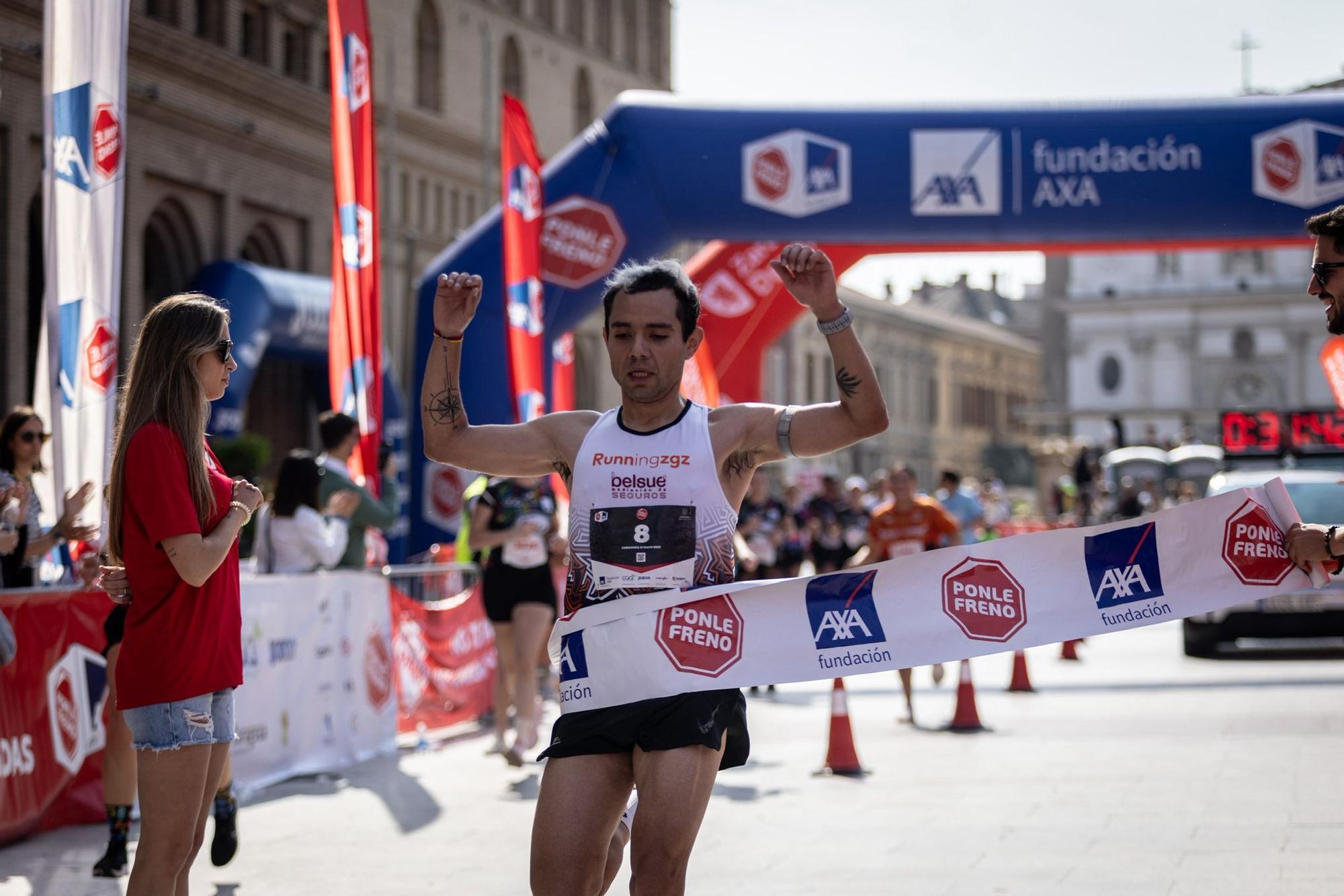 En imágenes | La carrera Ponle Freno sca a la calle a miles de personas en Zaragoza