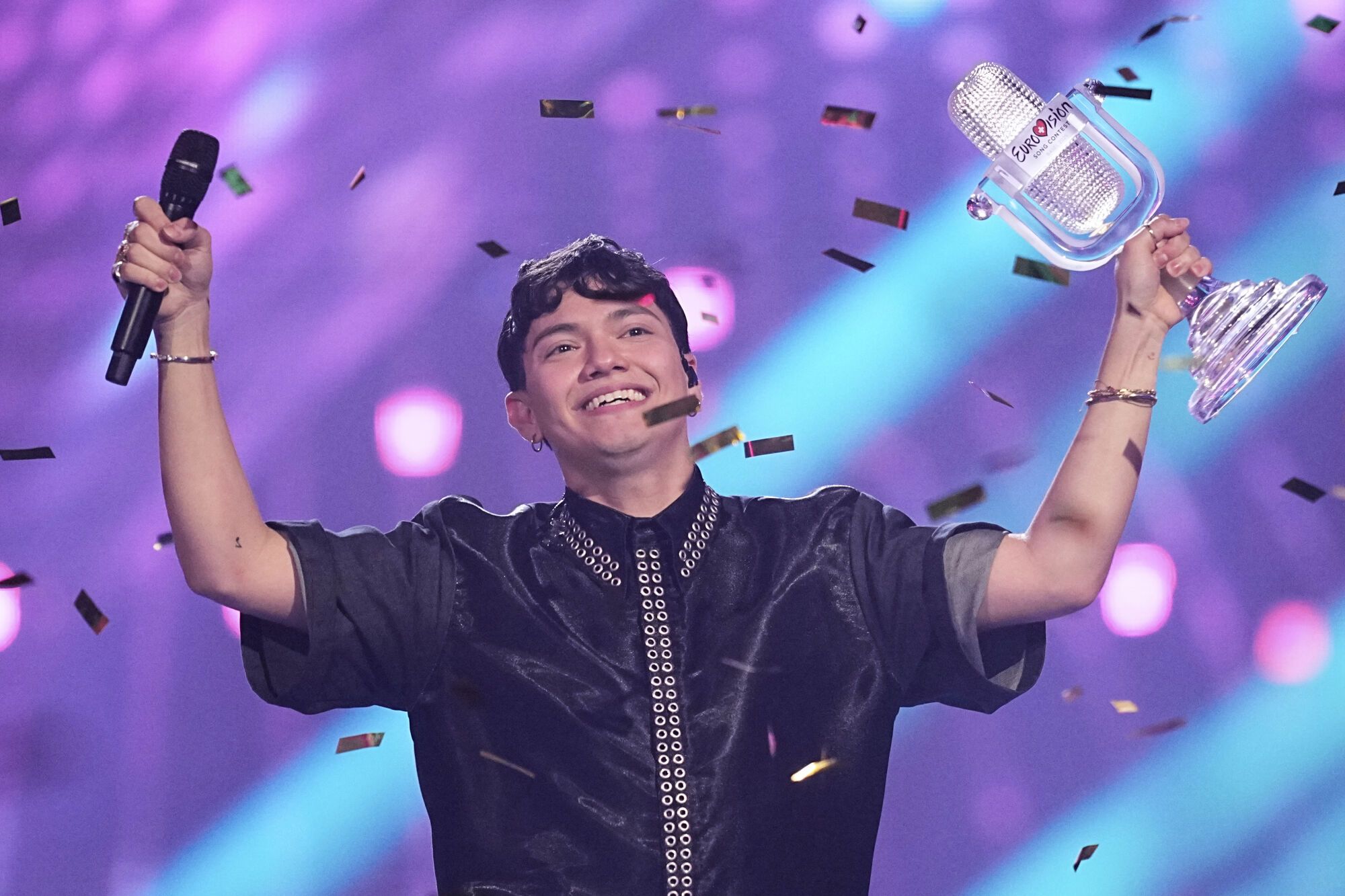 Winner of the Eurovision Song Contest JJ from Austria holds up the trophy, he won with the song "Wasted Love" during the Grand Final of the 69th Eurovision Song Contest, in Basel, Switzerland, Saturday, May 17, 2025. (AP Photo/Martin Meissner)