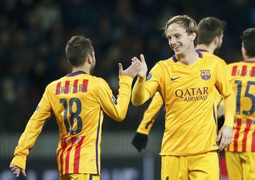 Barcelona's Rakitic celebrates with his team mate Alba after scoring goal against BATE Borisov during their Champions League group E soccer match at Borisov Arena stadium outside Minsk