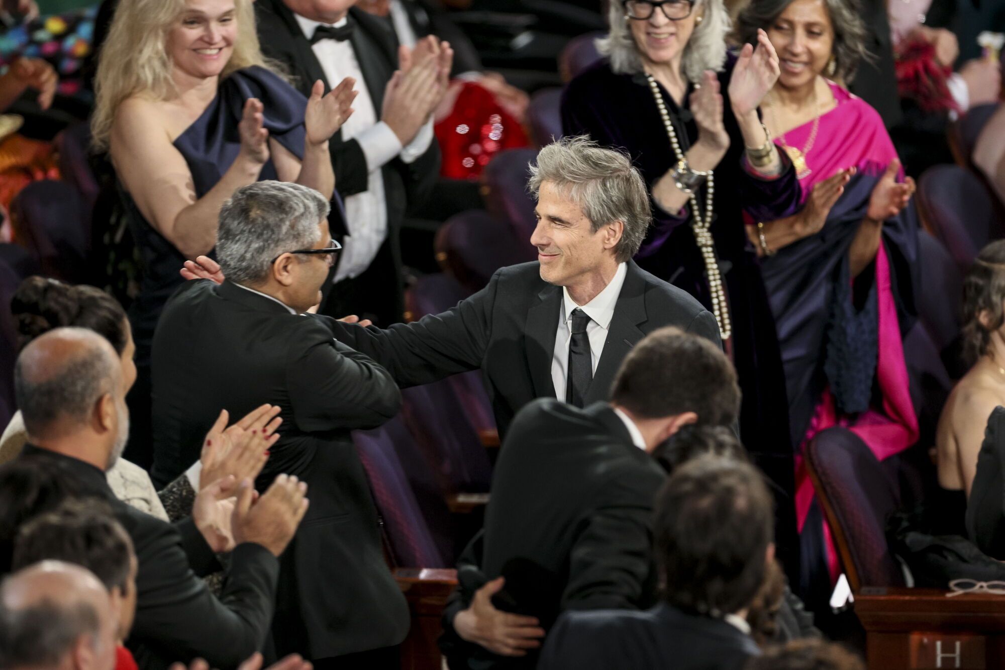 LOS ANGELES (United States), 03/03/2025.- Walter Salles (C) of Brazil reacts to winning the Oscar for Best International Feature Film for 'I'm Still Here' during the 97th annual Academy Awards ceremony at the Dolby Theatre in the Hollywood neighborhood of Los Angeles, California, USA, 02 March 2025. (Brasil) EFE/EPA/ALLISON DINNER