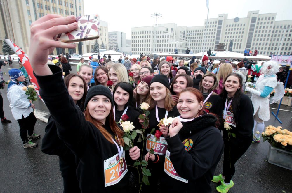 Women participate in the "Beauty Run" to mark ...