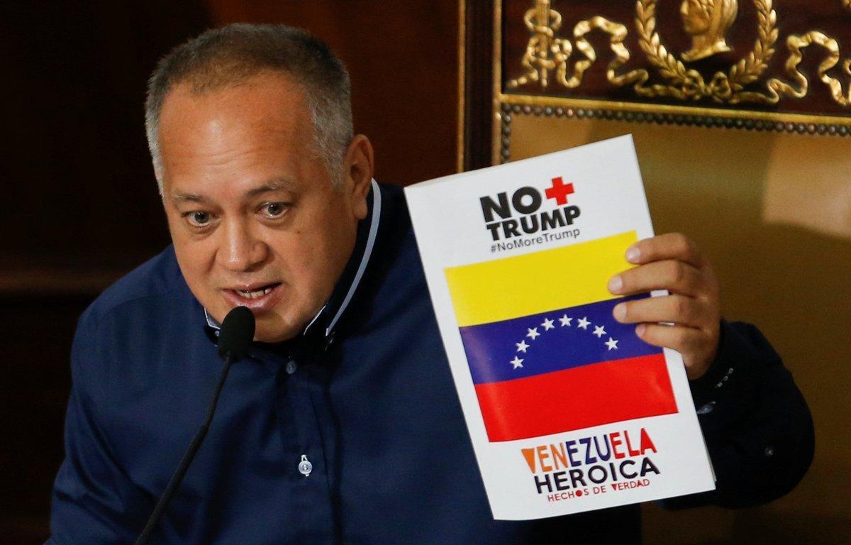 Venezuela s National Constituent Assembly President Diosdado Cabello holds a banner reading  No more Trump  Heroic Venezuela  during a session in Caracas  Venezuela August 12  2019  REUTERS Manaure Quintero