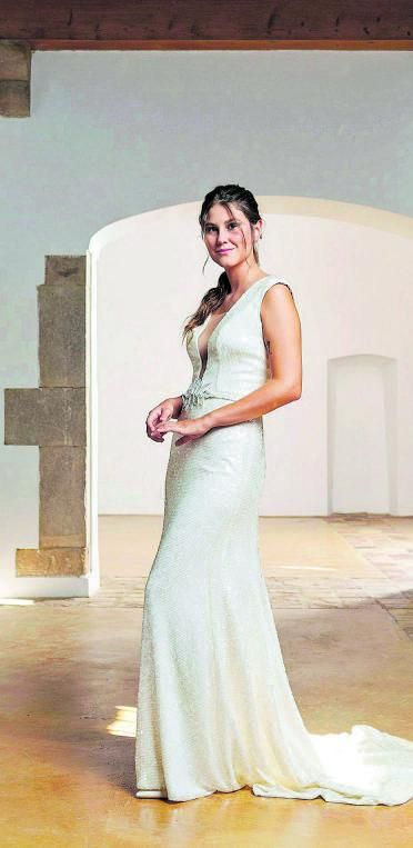 Una núvia lluint un model de Francesca Marlop. | DDG