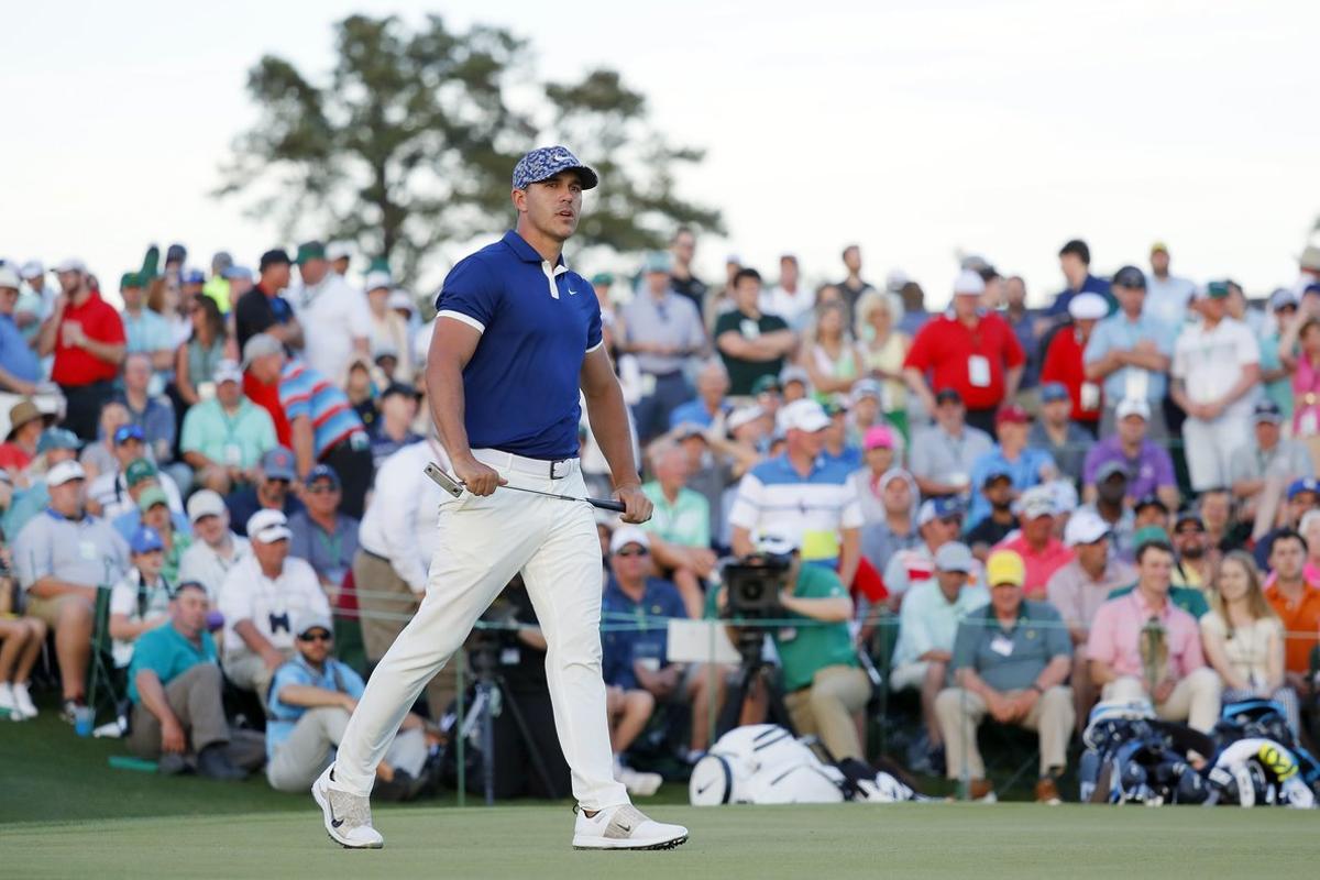 AUGUSTA, GEORGIA - APRIL 11: Brooks Koepka of the United States reacts to a missed birdie putt on the 18th green during the first round of the Masters at Augusta National Golf Club on April 11, 2019 in Augusta, Georgia.   Kevin C. Cox/Getty Images/AFP