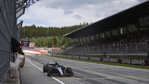 FILE - Mercedes driver George Russell of Britain crosses the finish line during the Austrian Formula One Grand Prix race at the Red Bull Ring racetrack in Spielberg, Austria, June 30, 2024. (AP Photo/Christian Bruna, Pool, File). FILE POOL PHOTO