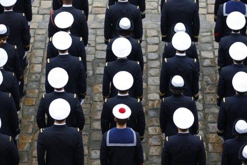 French Navy sailors attend a ceremony in the courtyard of the Invalides in Paris