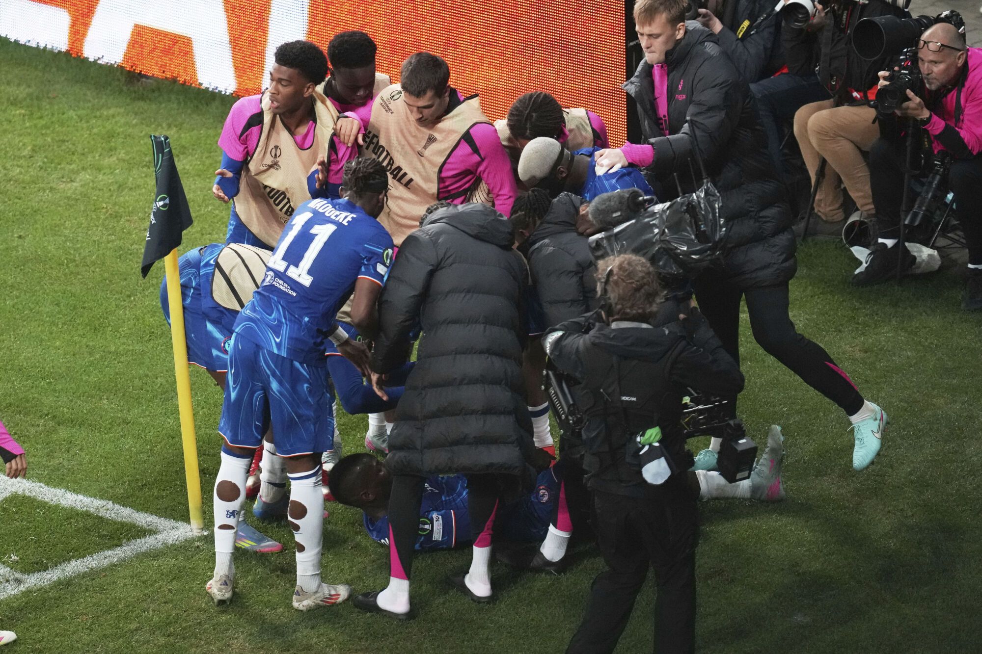 Chelsea's Nicolas Jackson, bottom, celebrates with his teammates after scoring his side's opening goal during the Europa Conference League final soccer match between Real Betis and Chelsea in Wroclaw, Poland, Wednesday, May 28, 2025. (AP Photo/Darko Vojinovic)