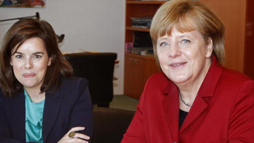 Angela Merkel y Soraya Sáenz de Santamaría.