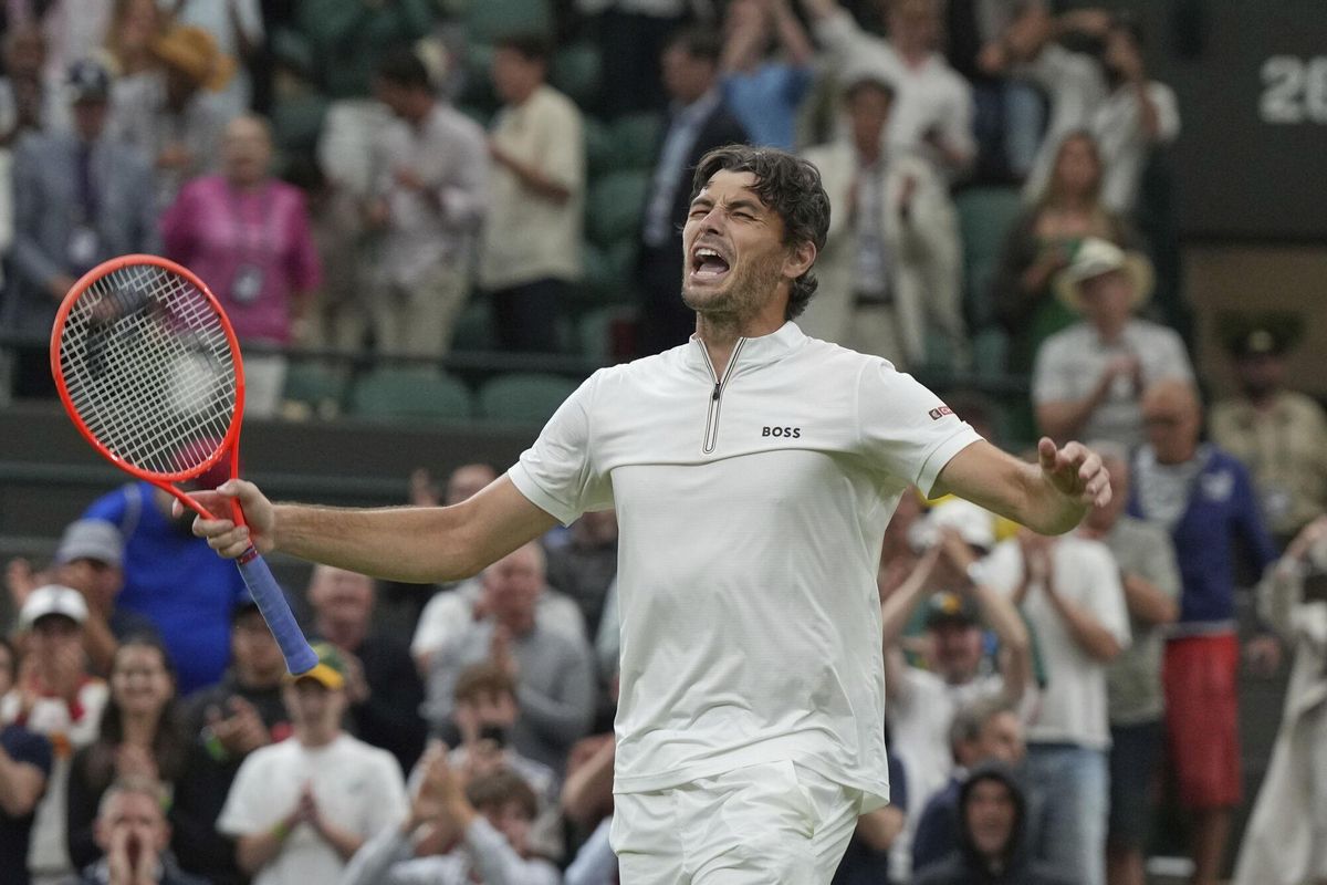 Taylor Fritz of the U.S. reacts after beating Gabriel Diallo of Canada in their second round men's singles match at the Wimbledon Tennis Championships in London, Wednesday, July 2, 2025. (AP Photo/Alastair Grant)