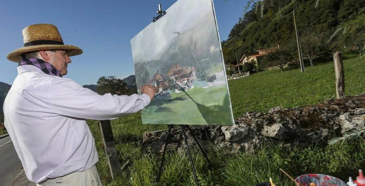 Pintor y caballete con hórreo al fondo