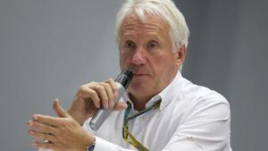 FILE - In this Oct. 10, 2014, file photo, Charlie Whiting, International Automobile Federation, or FIA, Race Director, gestures answering a question during a news conference at the ’Sochi Autodrom’ Formula One circuit , in Sochi, Russia. The governing body for international auto racing says its Formula One director Whiting has died from a pulmonary embolism. He was 66. The FIA issued a statement Thursday, March 14, saying Whiting died in Melbourne, where the season-opening Australian Grand Prix will be raced on Sunday.  (AP Photo/Pavel Golovkin, File)