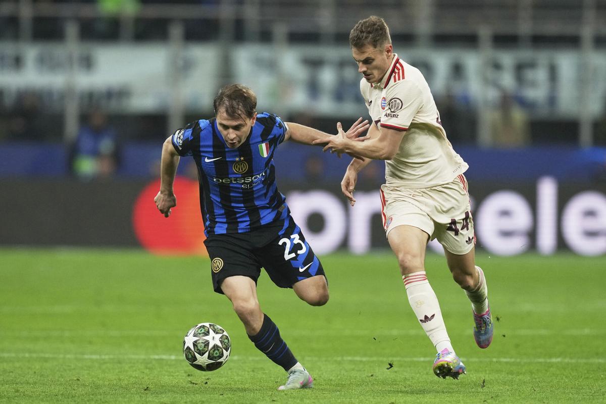 Inter Milan's Nicolo Barella, left, challenges for the ball with Bayern's Josip Stanisic during the Champions League quarterfinal second leg soccer match between Inter Milan and Bayern Munich at the San Siro stadium in Milan, Italy, Wednesday, April 16, 2025. (AP Photo/Antonio Calanni)